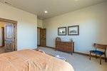 Master bedroom with charming touches. Relax in a cozy King size bed to recharge. Attached master bathroom.